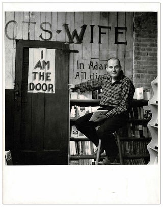 Item #4215 ORIGINAL PHOTOGRAPH OF LAWRENCE FERLINGHETTI IN THE BASEMENT OF CITY LIGHTS BOOKSTORE....