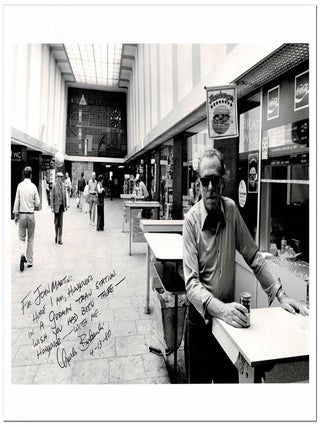 Item #8031 ORIGINAL PHOTOGRAPH OF CHARLES BUKOWSKI, INSCRIBED TO JOHN MARTIN. Charles Bukowski,...